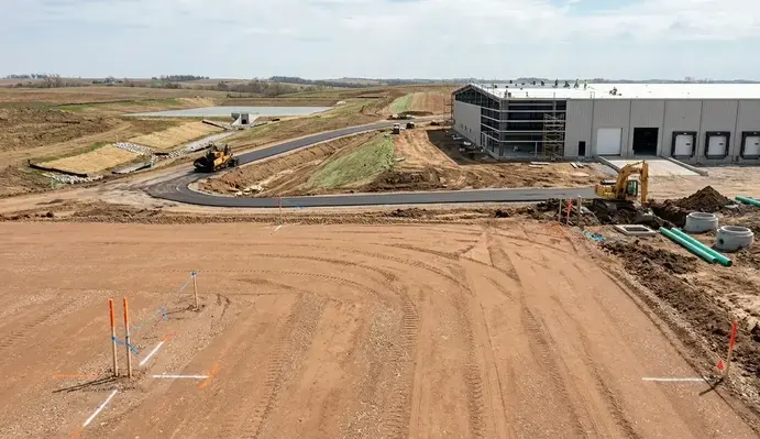 Commercial site development process from land clearing and grading through utility installation and building pad preparation