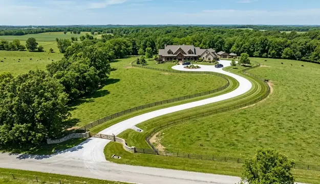 Completed gravel driveway leading to a rural home on acreage in North Missouri