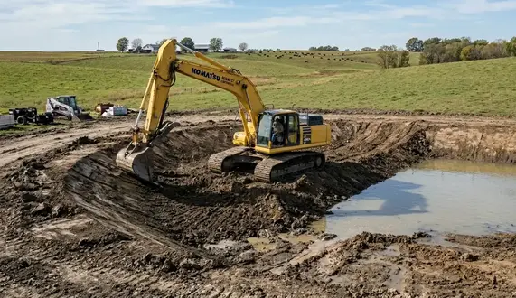 Livestock pond excavation project on a North Missouri cattle farm with watershed-fed pond construction