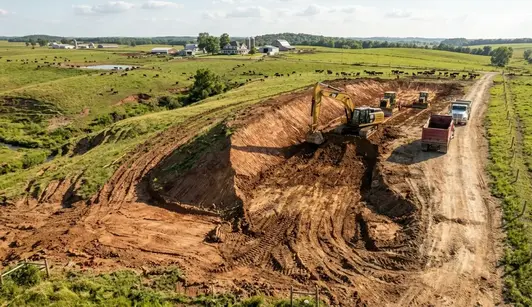 North Missouri farm showing clay soil terrain, rolling pasture ground, drainage patterns, and agricultural excavation work