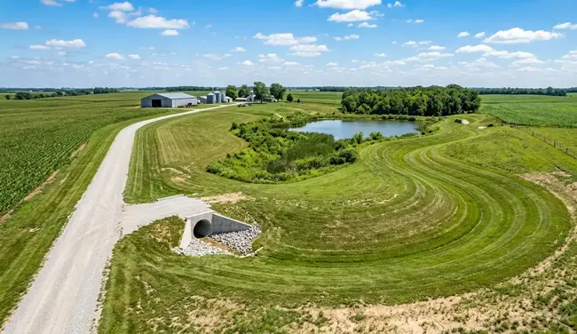 Completed land grading project in North Missouri showing proper slope and functioning drainage flow