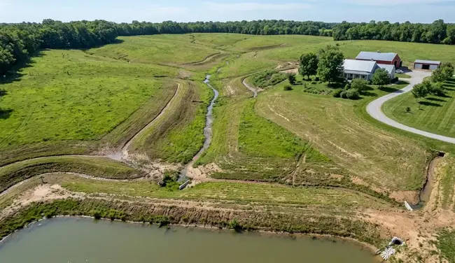Aerial view showing how stormwater naturally moves across a North Missouri property through slopes, swales, and drainage paths